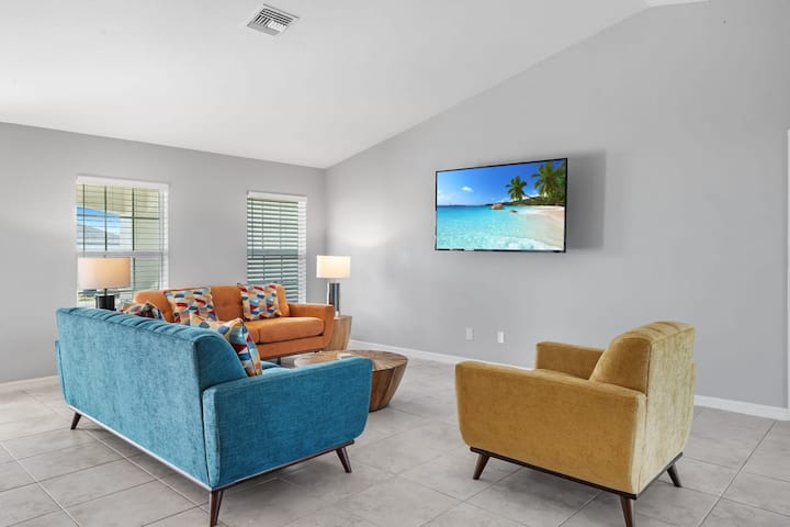Open living room and kitchen with 65 inch flat screen smart TV, stong WiFi and fully-equipped kitchen with all major appliances.