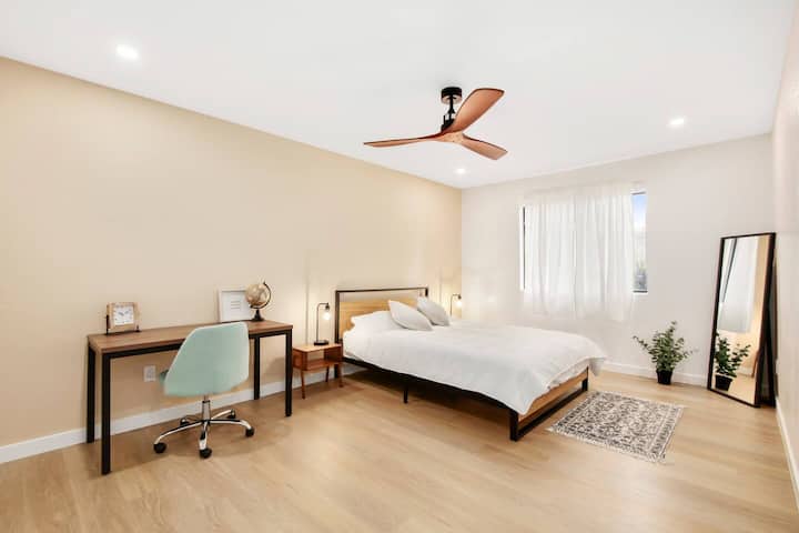 Discover the ideal harmony of relaxation and productivity in Queen Bedroom #1, thoughtfully designed to include a dedicated workspace desk. Unwind in the comfort of a regal queen bed while enjoying the convenience of a sleek and functional workspace.