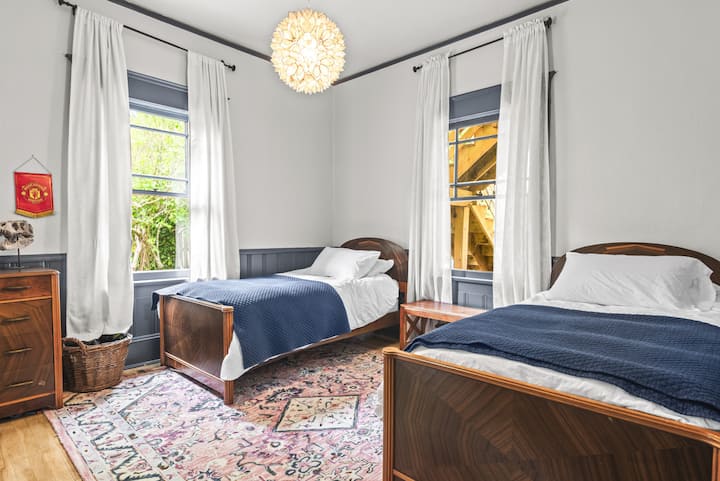 Matching twin beds made of tiger wood.
