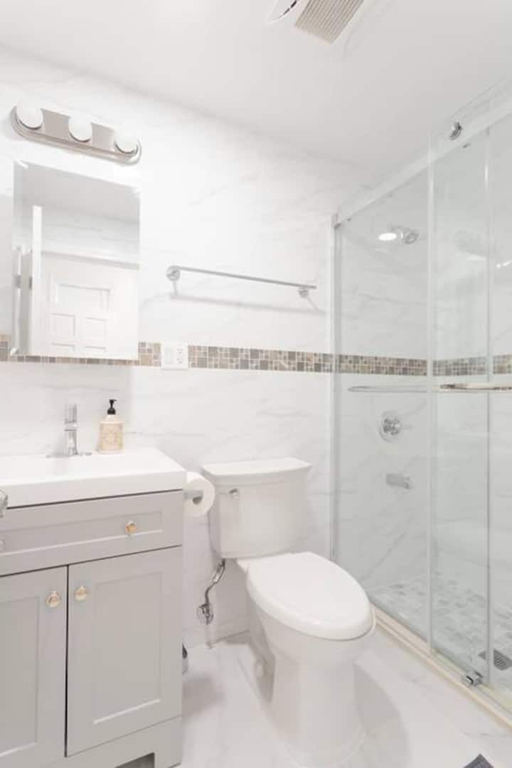 Full bathroom with vanity and glass shower