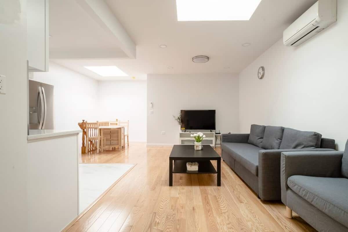 Open living and dining area with the kitchen beyond
