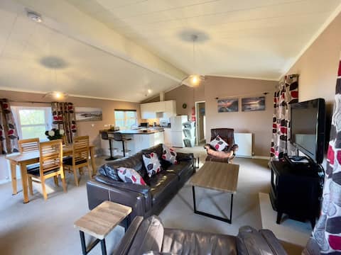 Luxury lodge situated on a tranquil holiday park