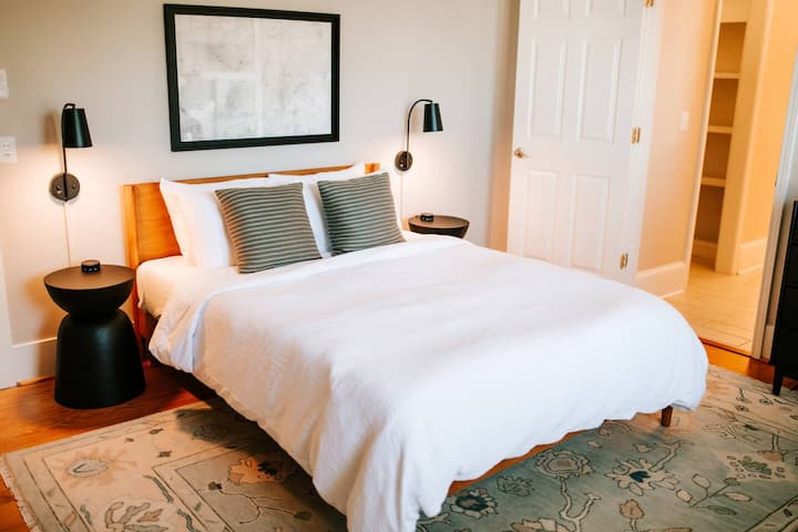 Every bedroom offers a comfortable queen-sized bed equipped with a Purple mattress and organic cotton sheets.