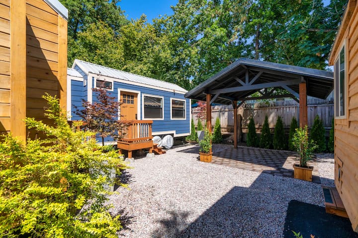 Restored Farmhouse & Backyard Tiny House Village