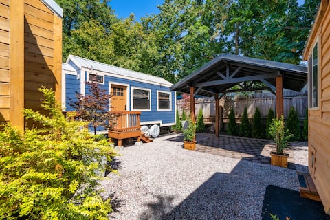 Restored Farmhouse & Backyard Tiny House Village