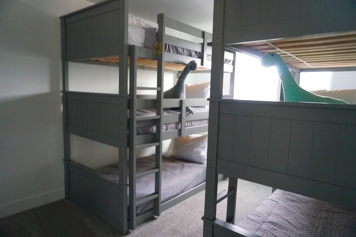 Bedroom 5: basement bunk room with 2 twin triple bunkbeds