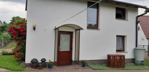 Holiday home with children's swing and barbecue