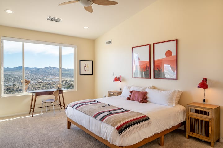 The Round Up's master bedroom is the perfect retreat after a day of exploring the breathtaking Joshua Tree National Park. Relax in style with modern desert-themed decor, plush bedding, and a view unlike any other.