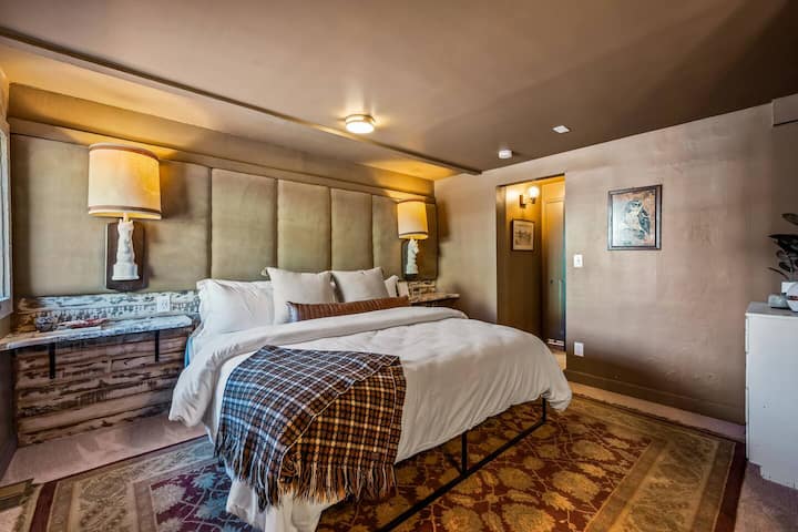 The Autumn bedroom includes a King bed and a unique headboard