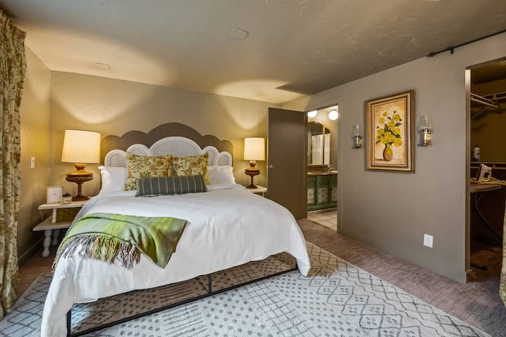 The Summer bedroom is near the patio and includes a King bed and walk-in closet