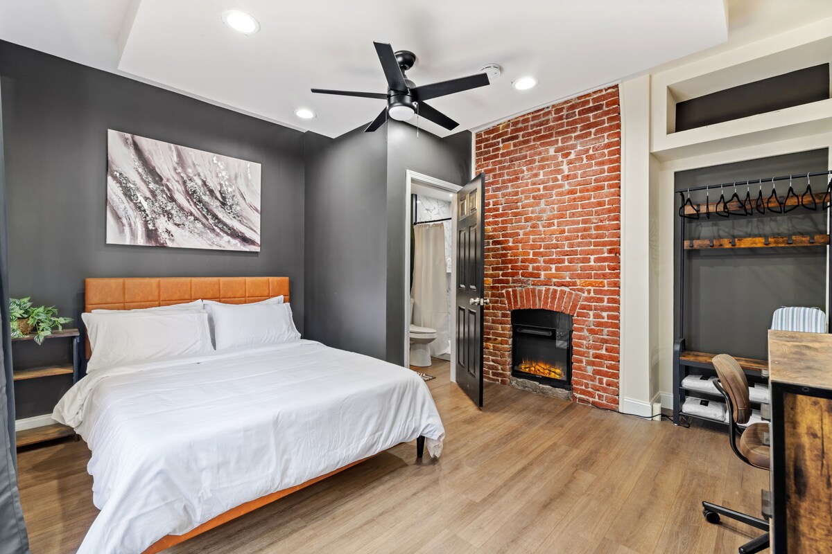 Our bedroom is a cozy haven designed for your utmost comfort. It has a built-in, adjustable electric fireplace.