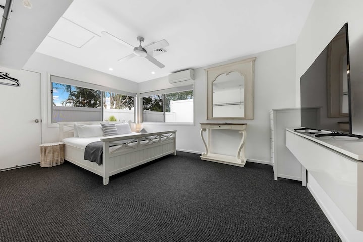 Bedroom 2 is downstairs and is equipped with a large smart tv and King sized bed. 