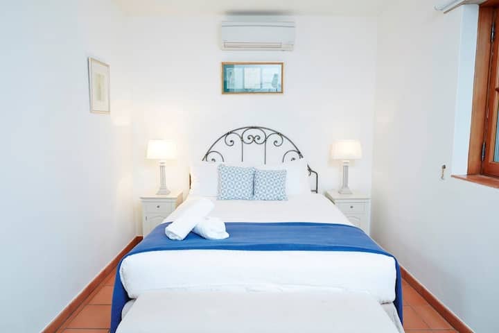 Bedroom 2 Cozy Guest Bedroom with a comfortable queen-sized bed and elegant decor.