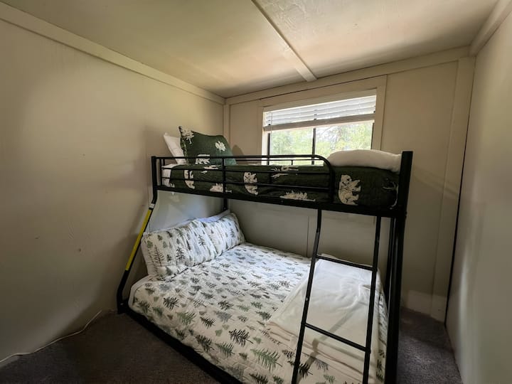 Twin over/full bunk beds in upstairs room