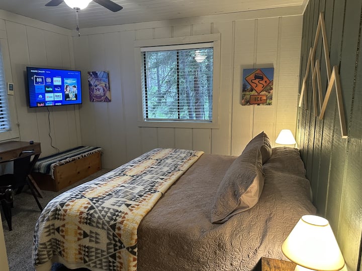 1st bedroom downstairs has a King, dedicated workspace and a new 43" smart TV