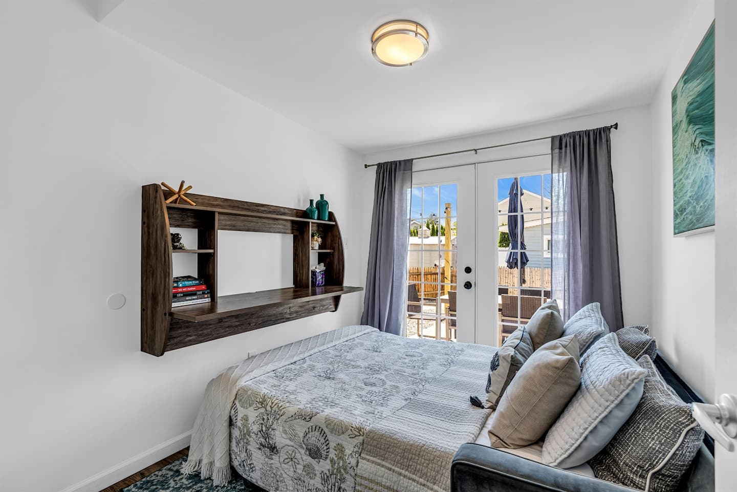 Back unit bedroom with a queen bed and french doors onto its own patio