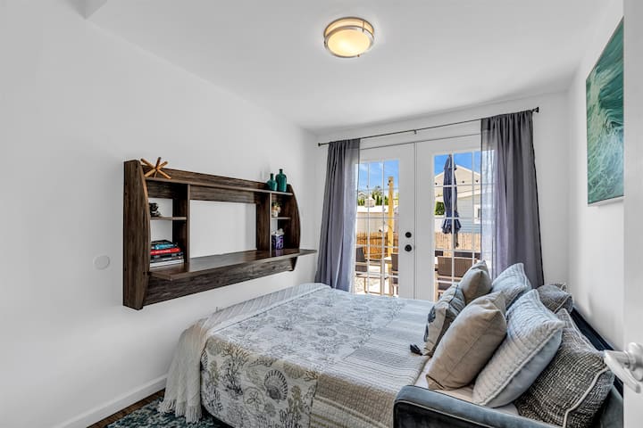 Back unit bedroom with a queen bed and french doors onto its own patio