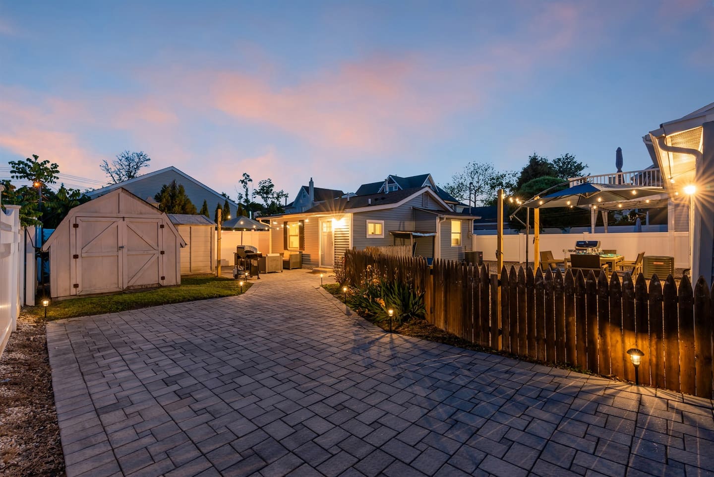 Welcome to Two separate houses sharing one yard, 3.5 blocks from the sand. This beach house combination offers everything you could ever want in a family and friends retreat walkable to beach and boards!