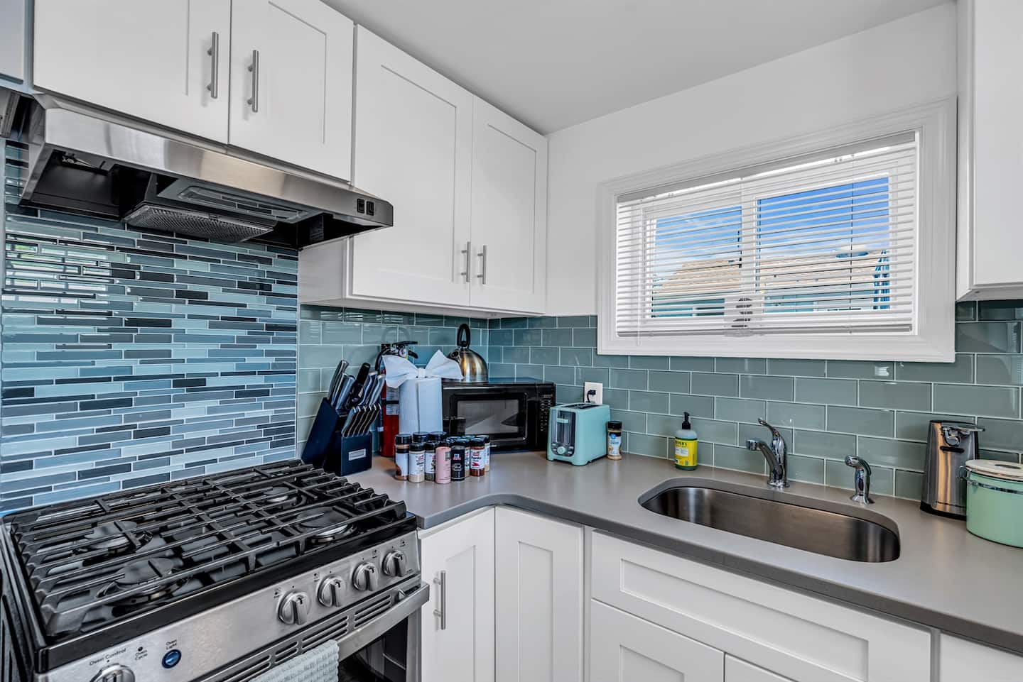 Bright, modern kitchen with all essentials and a touch of coastal style—cook with ease.