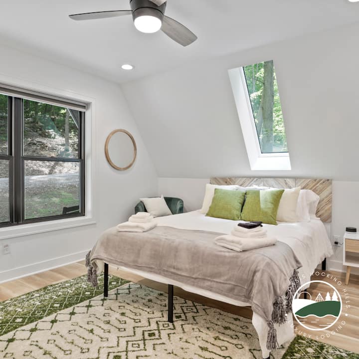 Main floor bedroom with Queen bed and luxury bedding