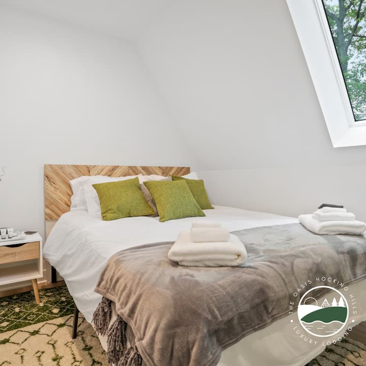 Second bedroom on the main floor with Queen bed and luxury bedding