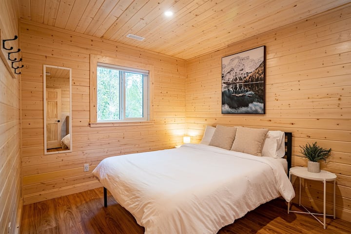 Lower Bedroom with comfy queen bed using a Douglas mattress