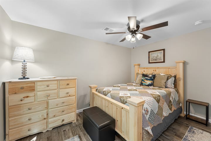 The primary bedroom has a queen bed and a closet.