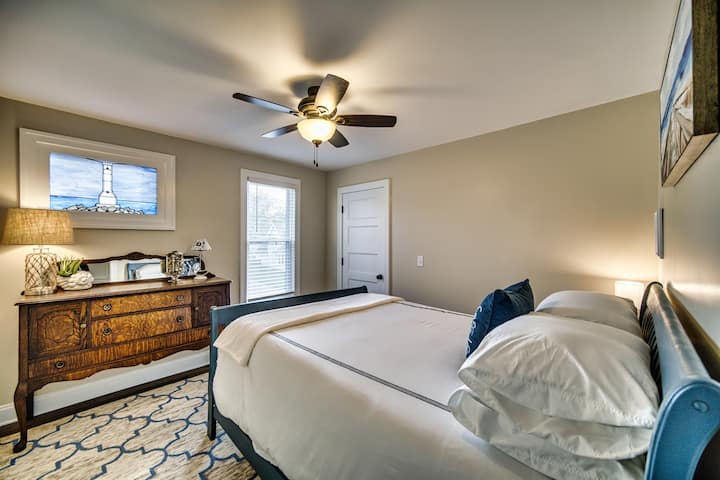 Lighthouse Room features a handmade, stained glass picture window of the Huron Lighthouse. Stunning shades of blue with serene beach artwork, our nod to Lake Erie. This room is guaranteed to make you feel relaxed and calm.