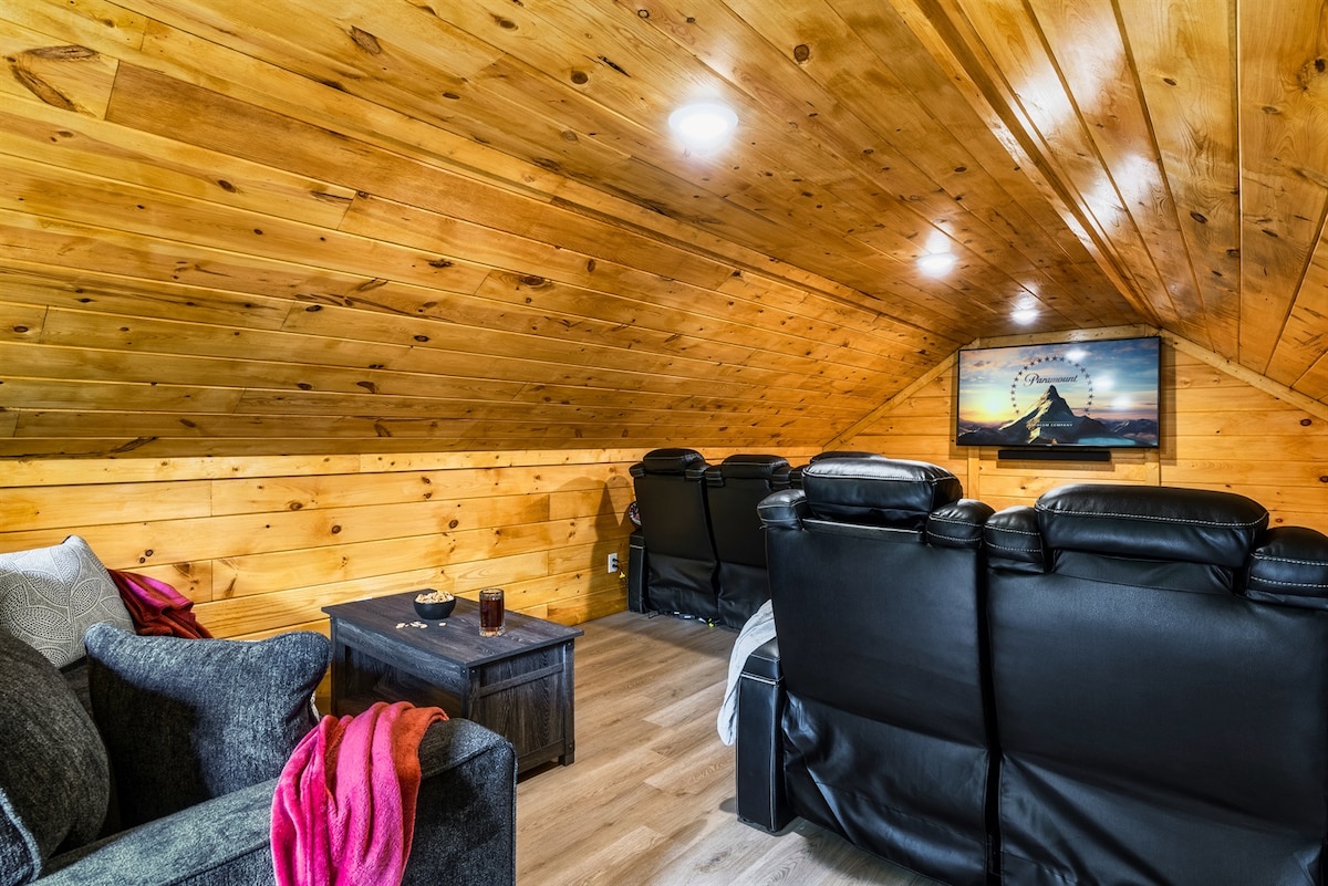 You'll enjoy the combination of spacious and cozy in our theater room along with the brand-new queen sleeper sofa.