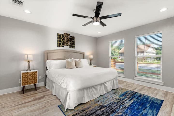 Bedroom 1: Dive into this cozy king-size bed.