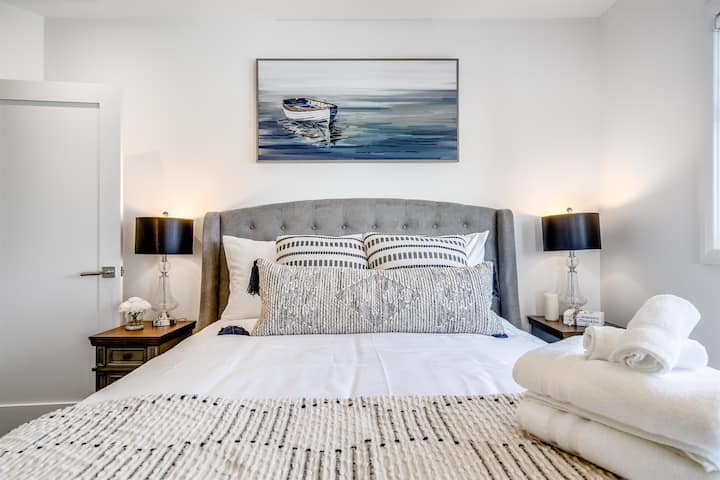 Cozy queen bedroom with welcoming & calming decor.