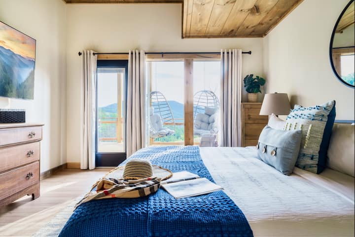 [Bedroom 2] The bed, a centerpiece of comfort, is strategically positioned to capture the best angles of the view.