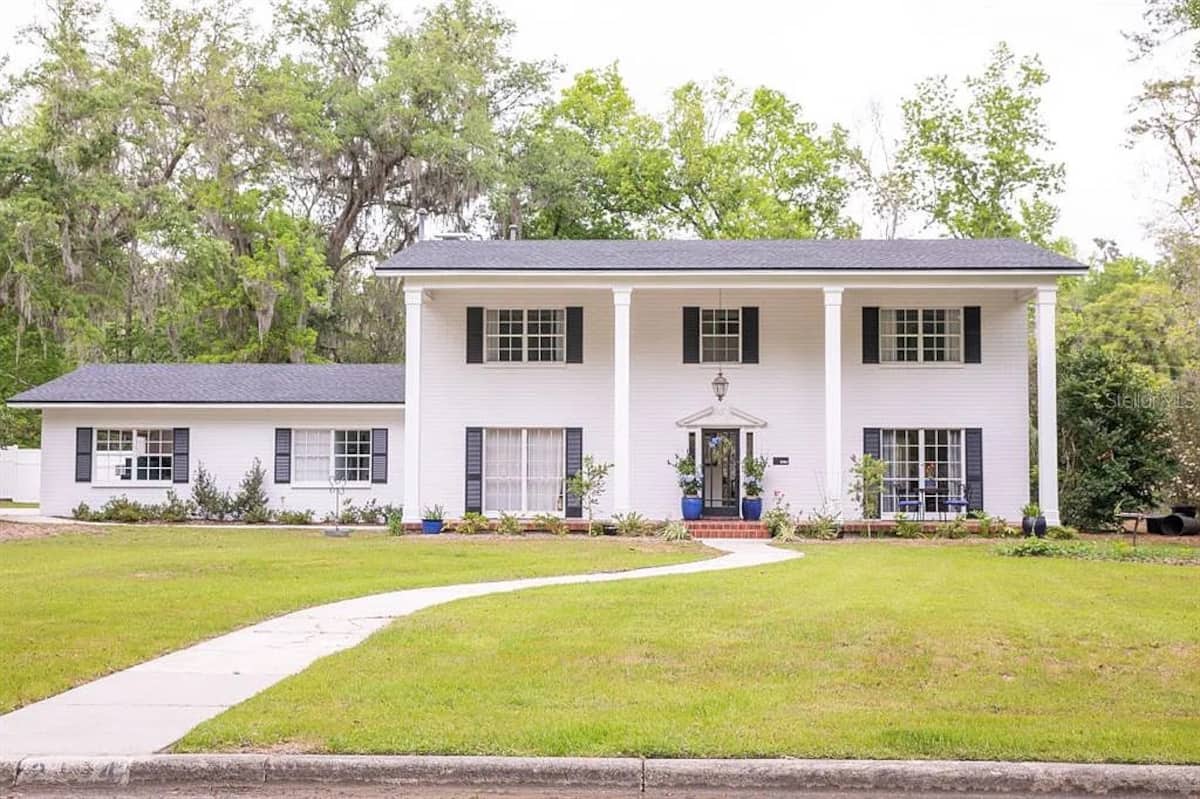 Coaches House Gainesville exterior with white columns