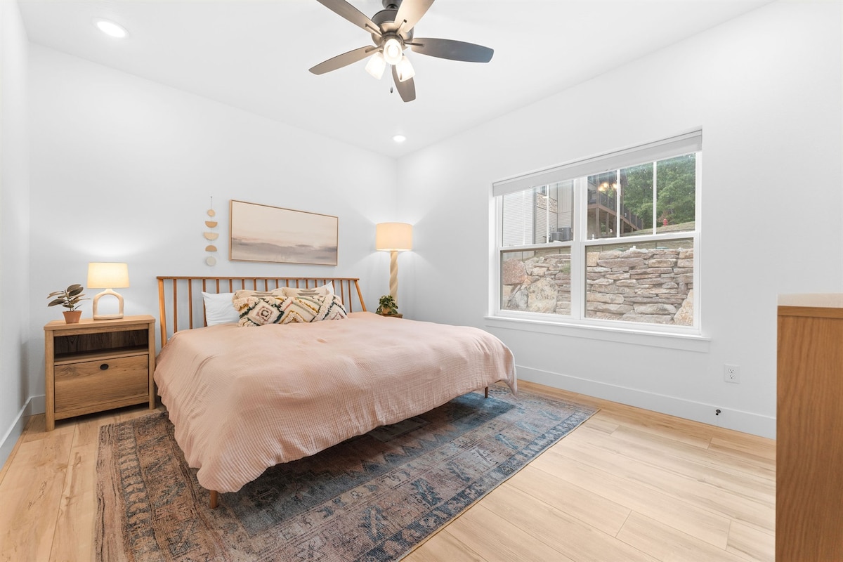 Main-floor 2nd Master with King-sized bed and luxurious duvet and en-suite bathroom