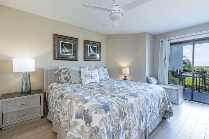 Sliding glass doors open directly to a private balcony, bringing in natural light and fresh island air.