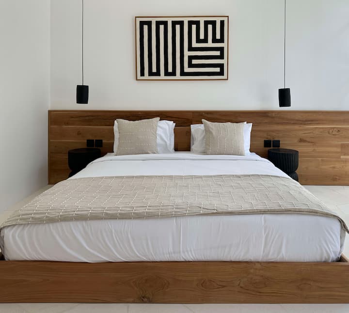 Designed with calming tones and elegant proportions, this bedroom invites slow mornings and restful nights. Thoughtful details and natural textures create an atmosphere of effortless sophistication.