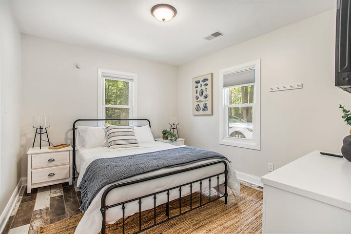 Rest in luxury in the cozy queen bedroom, a sanctuary for peaceful slumbers.