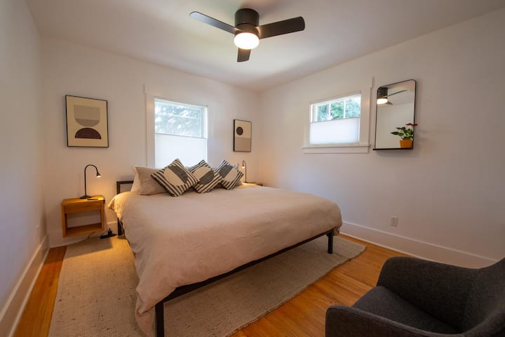 Bedroom on the main level with king sized bed. 