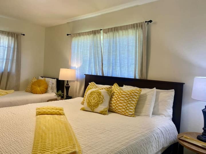 Second master bedroom with a king bed and a twin bed and en suite bathroom with shower