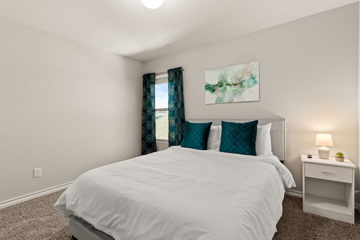 Bedroom 3: Third bedroom with full-size bed.