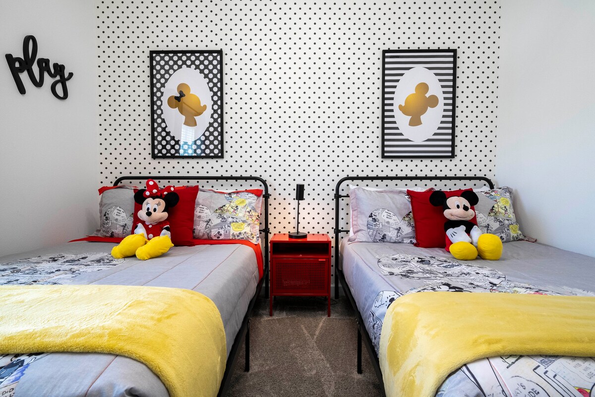 Step into our beautiful and vibrant Mickey Mouse themed kids' room, complete with two cozy single beds. This spacious and comfortable haven is perfect for your little ones to unwind and let their imaginations soar after a day of vacation excitement.