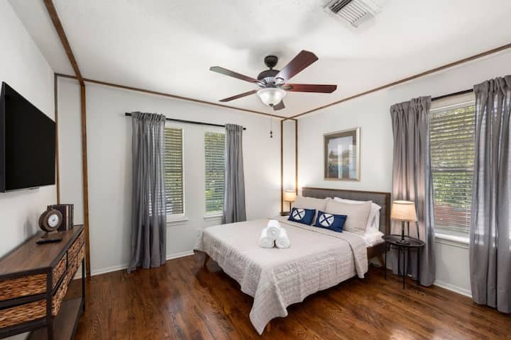 Bright upstairs queen bedroom with Smart TV — a comfortable retreat for restful nights.