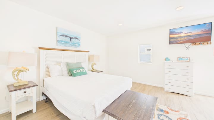 Separate guest house bedroom with queen bed and twin-over-twin bunks (sleeps 4)
