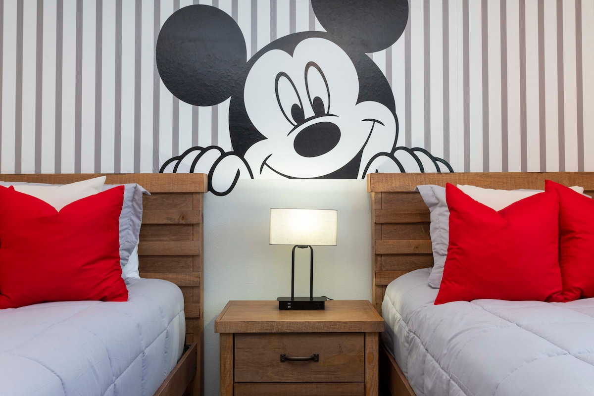 Welcome to the kids' room adorned with delightful Mickey Mouse decor and a two individual sized beds for every kids comfort! —a magical space designed to turn vacation time into an enchanting experience for your little ones. 