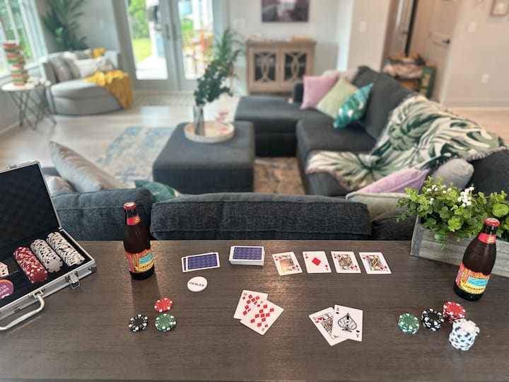 Spacious living room with open concept kitchen has lots seating areas for a big group.