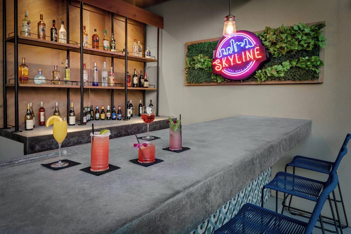 Close to UT Austin + Pool. Bar. Free Breakfast.