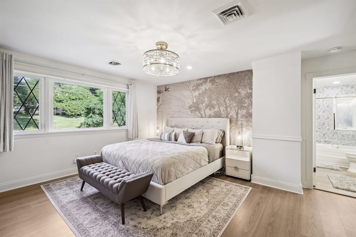 Relax in the nature inspired primary bedroom upstairs with a Cal King Bed.