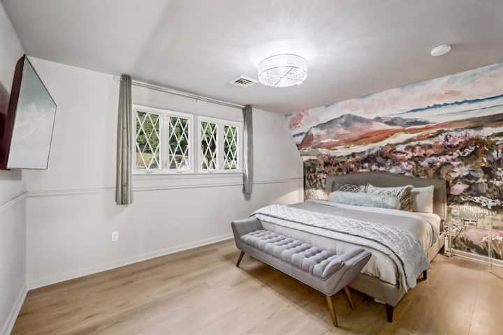 Enjoy waking up in this Cal King bed on the main level with a beautiful landscape mural.