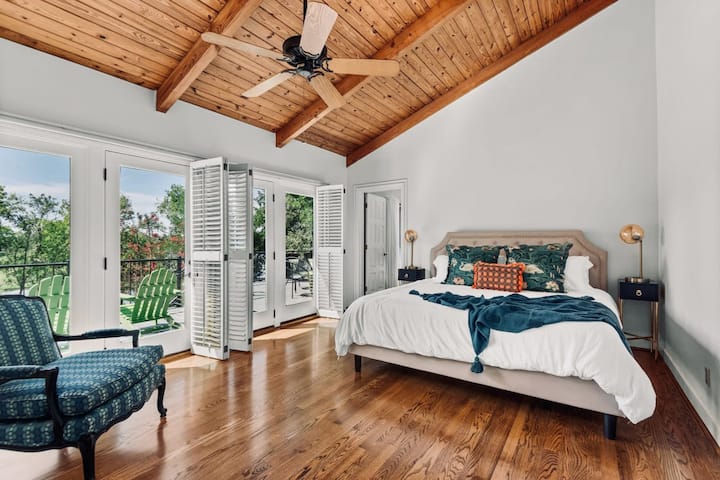 The Primary bedroom with 2nd story porch access overlooking the lake!