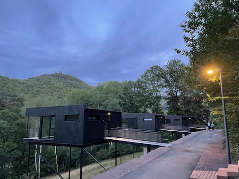 Mountain Chalet on stilts with castle view